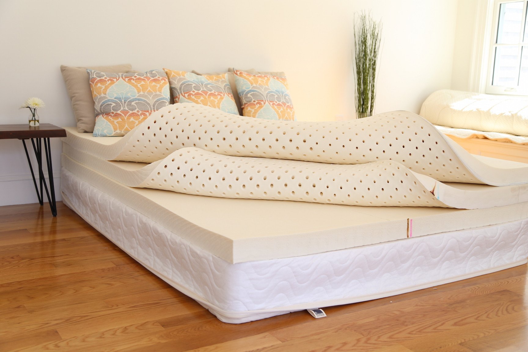 The Spindle natural latex mattress without the cotton/wool zippered cover pictured here. Three 3-inch Dunlop latex foam layers make up the core of the mattress.